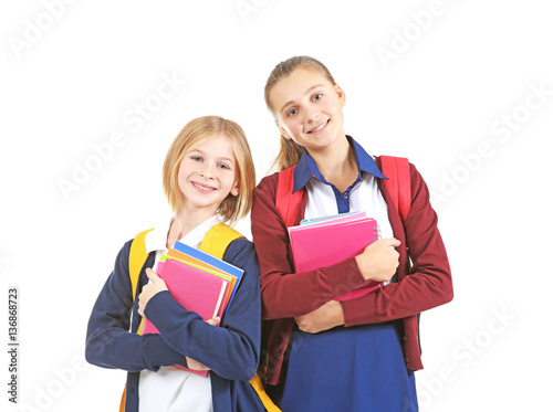 Two cute girls in school un...
