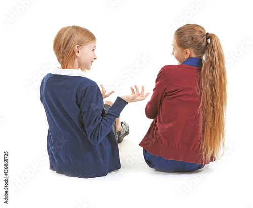 Two cute girls in school un...