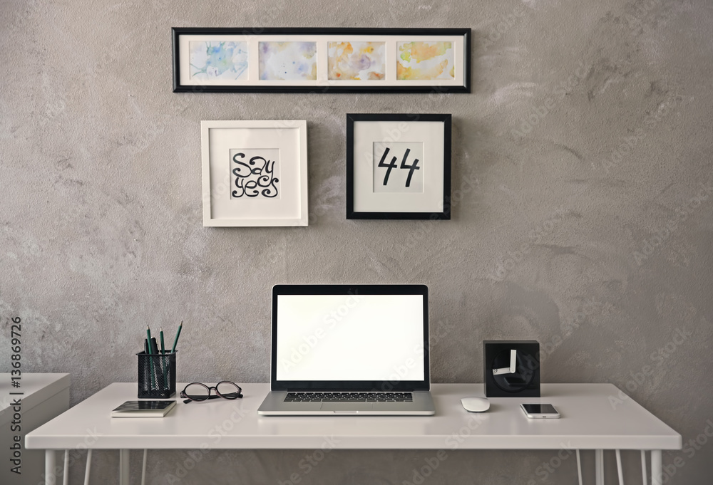 Fototapeta premium Modern workplace with laptop on table