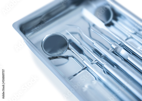 Tray with dentist equipment on white background