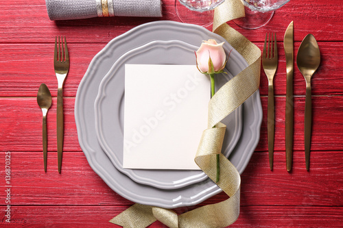 Elegant table setting with beautiful rose