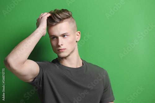 Handsome young man posing o...