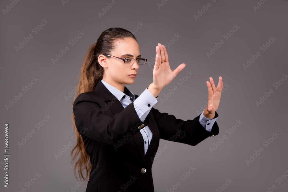 Young woman businesswoman pressing virtual buttons Young woman businesswoman pressing virtual buttons