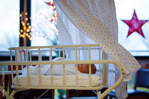 Fototapeta Naklejka Na Ścianę i Meble -  Portrait of cute adorable newborn baby girl in birth hospital.