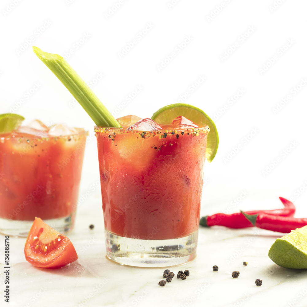 Bloody Mary cocktails with celery and lime Bloody Mary cocktails with celery and lime