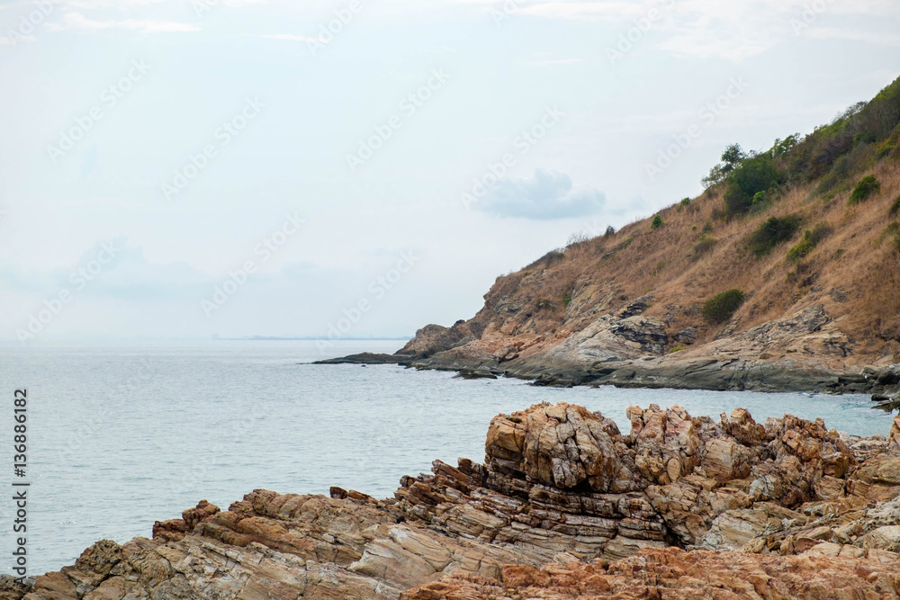 Rock cliff with view of the sea coastline