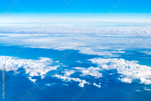 Aerial view of cloud and sky from airplane window looking down t