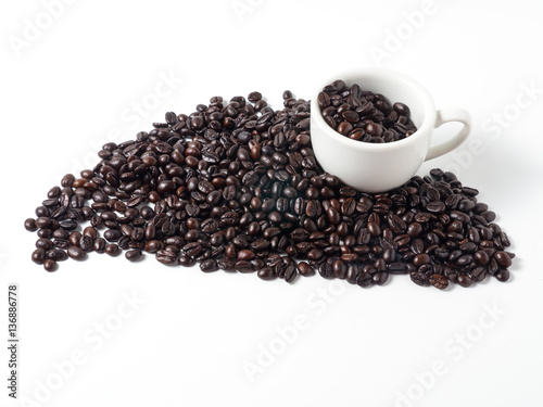 cup and coffee beans on white background
