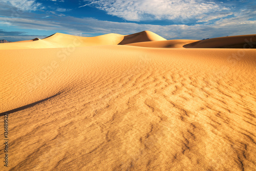 Sand dunes under blue sky. Mojave Desert  Death Valley  California  USA