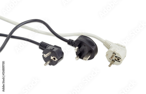 Three AC power plugs of two different standards