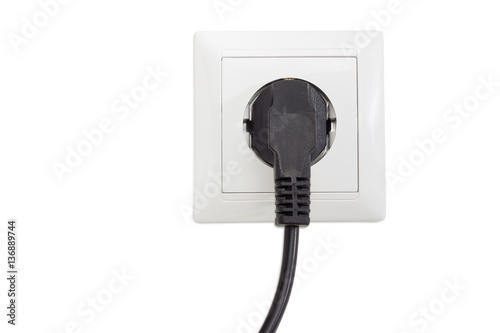 White socket outlet with connected corresponding power plug