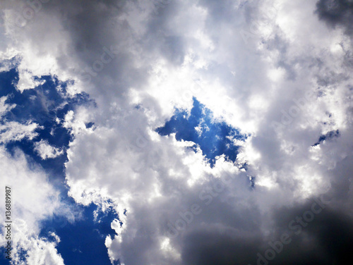 Backlit clouds on blue sky