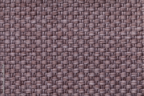 Brown background with checkered pattern, closeup. Structure of the fabric macro.