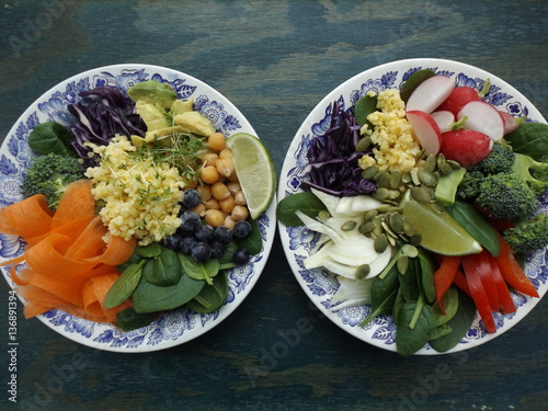 Buddha Bowl. The concept of healthy vegetarian food. Fresh raw vegetables, boiled millet and chickpeas. Two different variants photo