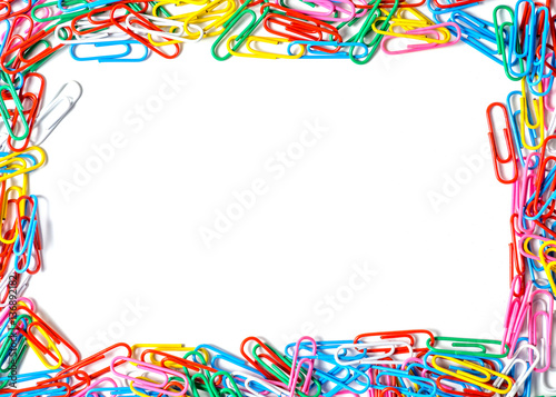 Multicolored paper clips isolated on white background with copy space for your sample text