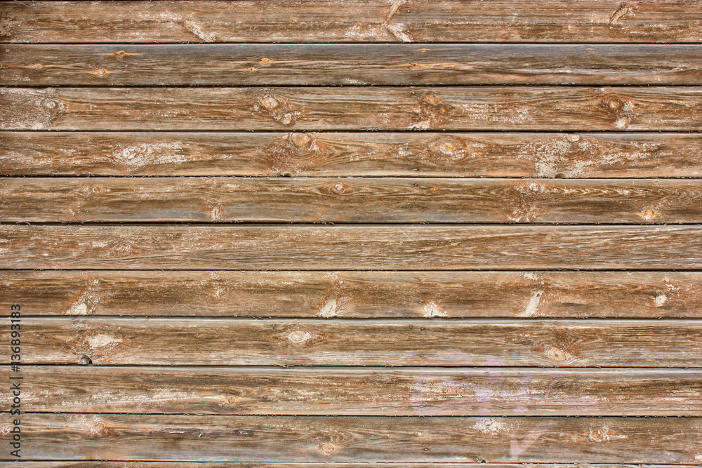 The wall of boards of an old building. Texture down time wood The wall of boards of an old building. Texture down time wood