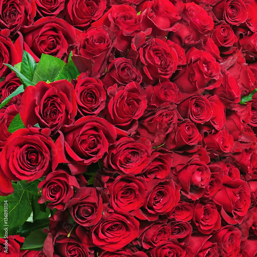 Colorful flower bouquet from red roses for use as background. Closeup.