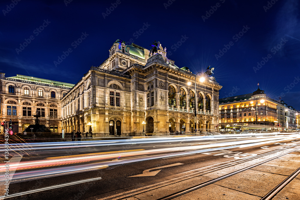 Wien opera building facade at night and traffic trails