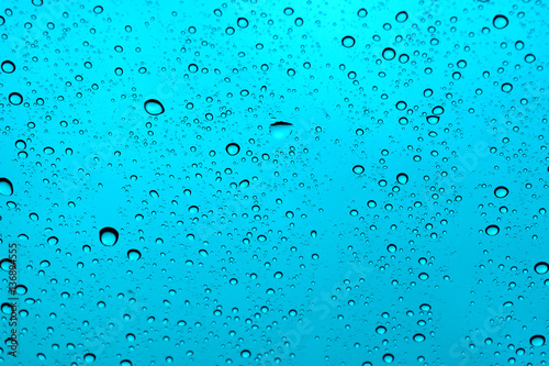 Фотография abstract water drop on windshield or water drop on sky backgroun