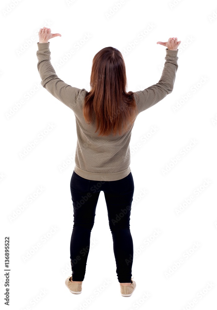 back view of woman protects hands from what is falling from above. woMan holding a heavy load Rear view people collection. backside view of person. Isolated over white background. Woman hands hol back view of woman protects hands from what is falling from above. woMan holding a heavy load Rear view people collection. backside view of person. Isolated over white background. Woman hands hol