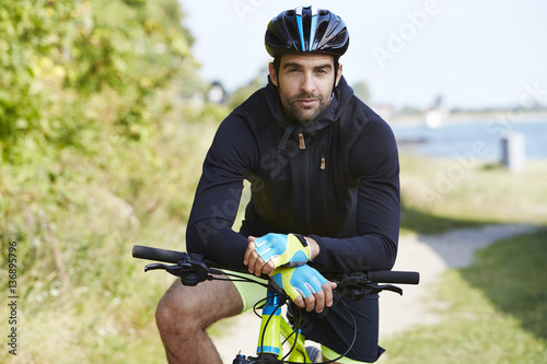 Seriously cycling man in helmet, portrait