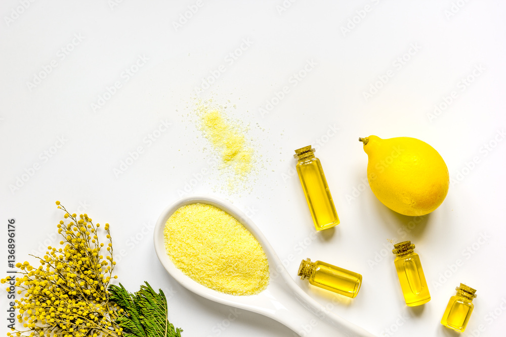 Sea salt with oils and lemon white background top view mock-up Sea salt with oils and lemon white background top view mock-up