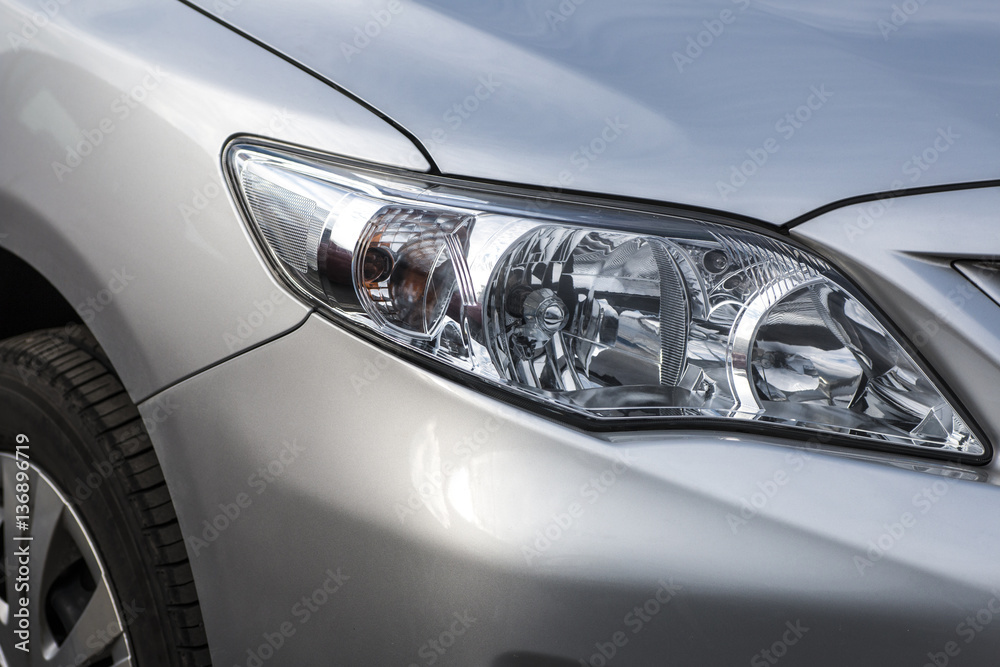 Closeup headlights . Modern  car.  Concept of expensive auto
