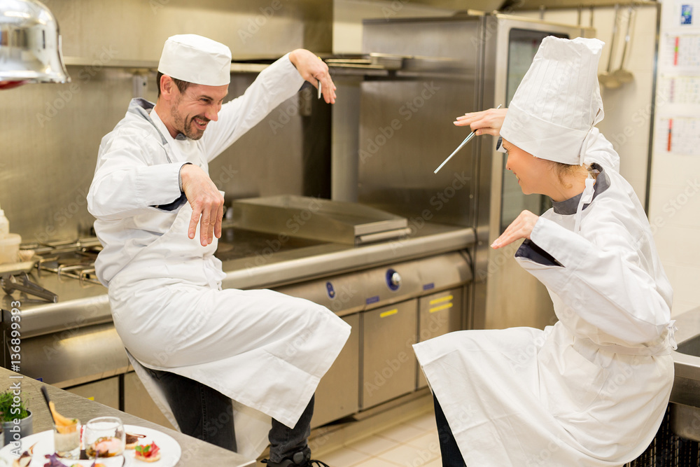 funny match in kitchen between chefs
