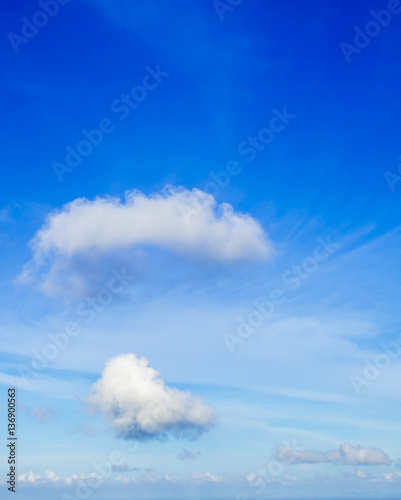 Blue sky and fluffy clouds photo