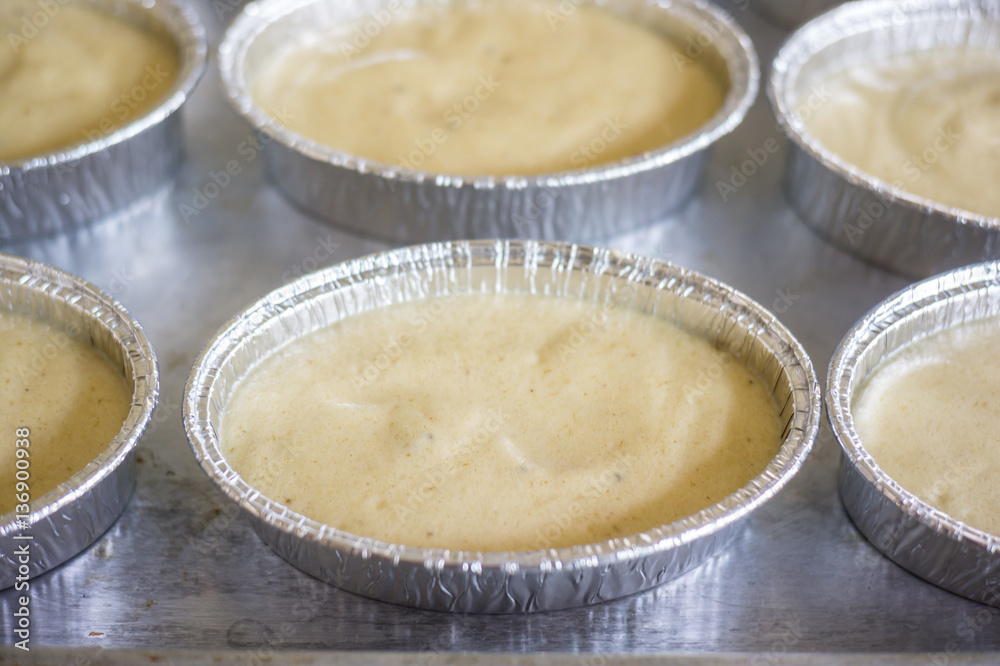 uncooking , making cakes, Close up uncooking cake on steel tray. uncooking , making cakes, Close up uncooking cake on steel tray.