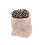 Coffee beans in burlap isolated on white.