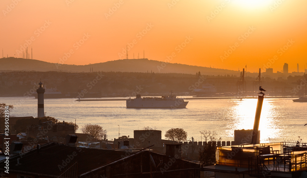 Beautiful view at Bosporus channel over traditional Istanbul cityscape, turkish style architecture. Dawn scenery. Istanbul, Turkey.