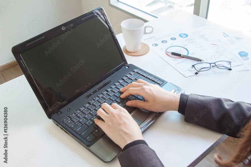 business documents on office table with laptop computer and graph financial diagram and Business people working at office business documents on office table with laptop computer and graph financial diagram and Business people working at office