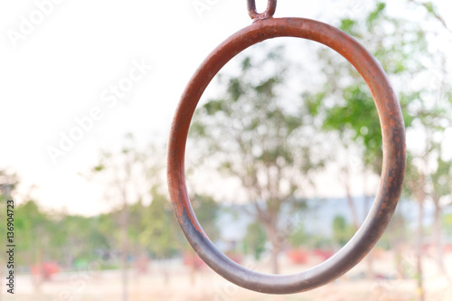 colorful old iron ring in playground at the school garden with b