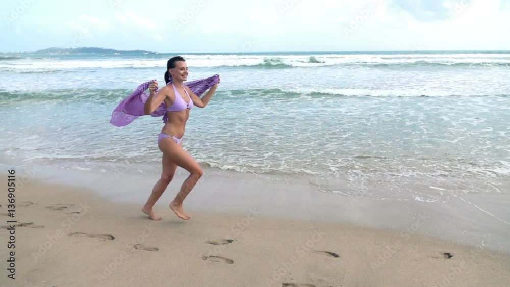 Happy woman with pareo running on beach, super slow motion 240fps
Happy woman with pareo running on beach, super slow motion 240fps