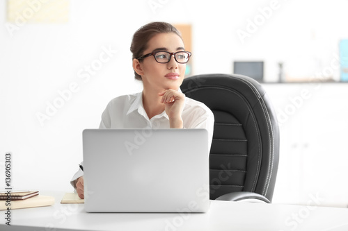 Beautiful young woman worki...