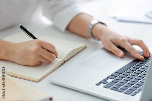 Young woman working in office, closeup