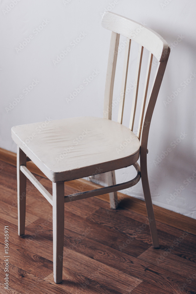 Old wooden white chair in the room Old wooden white chair in the room