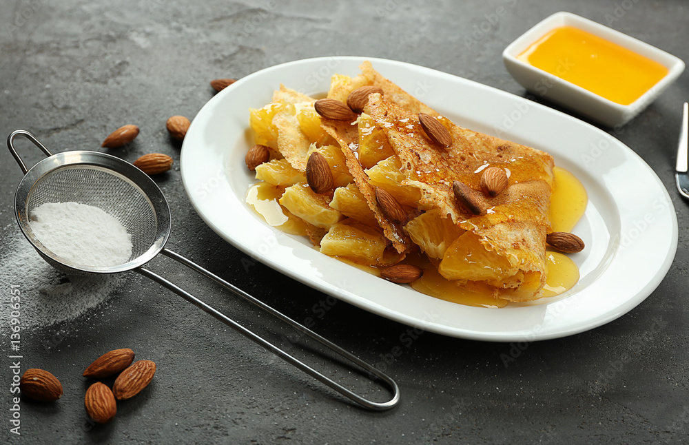 Tasty pancakes with pineapple and almonds on plate Tasty pancakes with pineapple and almonds on plate
