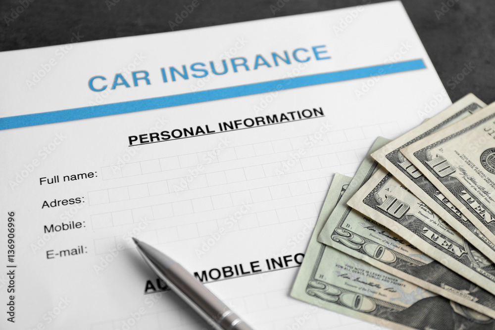 Car insurance form and money on table Car insurance form and money on table