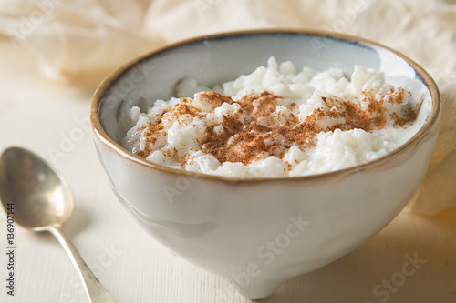 Traditional rice pudding with cinnamon. Light background. Tasty