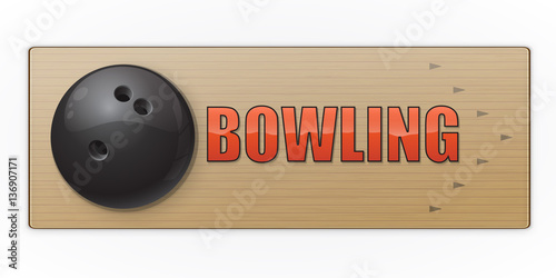 Black ball on the alley for bowling game.