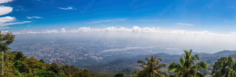 View of mountain peaks, coniferous tropical forest. Panorama