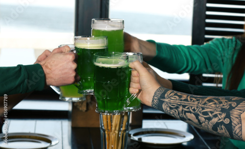 Hands of people with beer c...