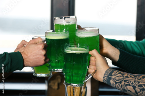 Hands of people with beer c...