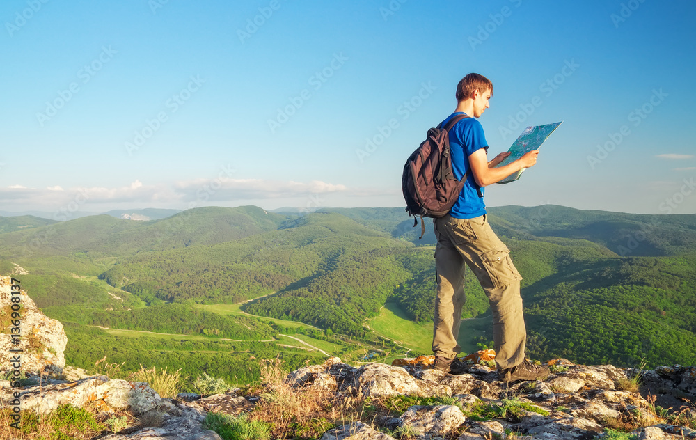 Man on top of mountain. Tourism concept