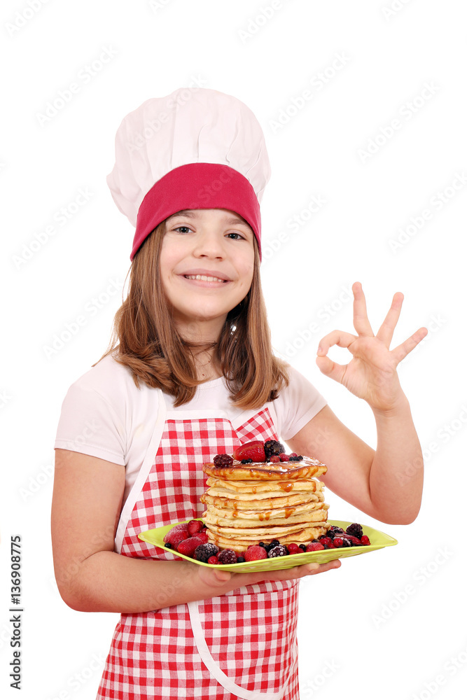 happy little girl cook with pancake and ok hand sign happy little girl cook with pancake and ok hand sign