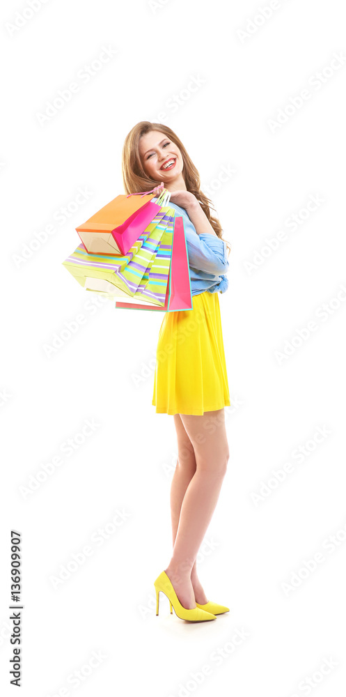 Beautiful young woman with paper bags on white background Beautiful young woman with paper bags on white background