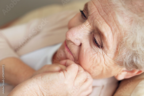 Depressed elderly woman at ...