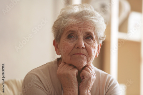 Depressed elderly woman at home